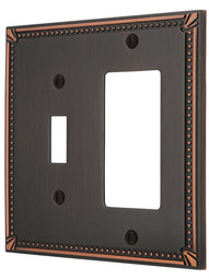 Imperial Bead Toggle/GFI Combination Switch Plate in Aged Bronze.